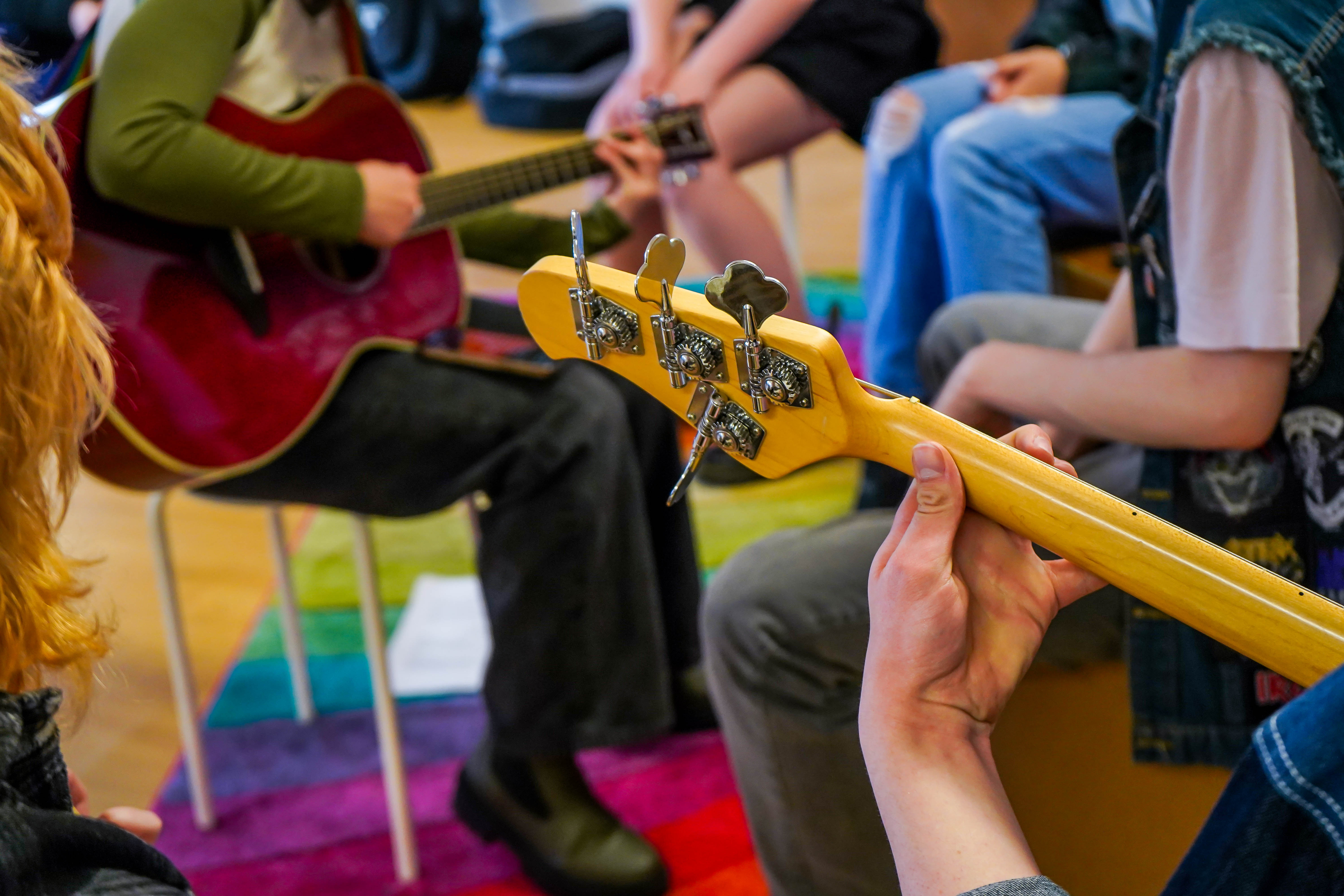 young people play guitars