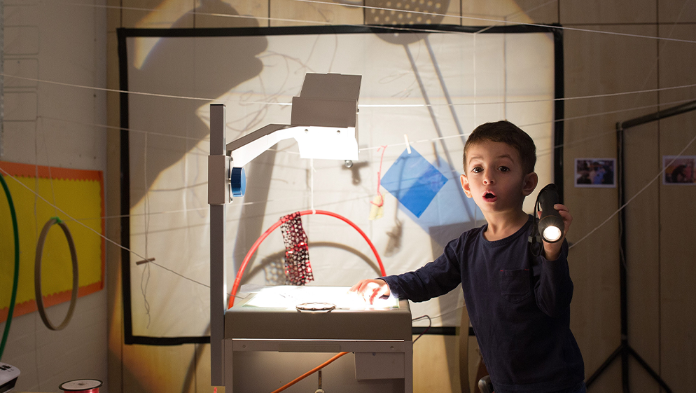 a child plays with an art installation