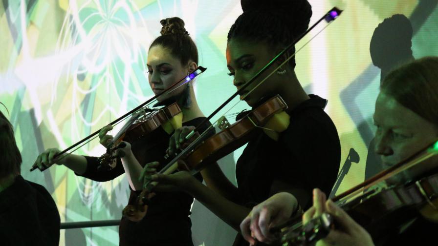 String Quintet against a projected light background