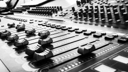 Black and white photo of Music Mixer board.