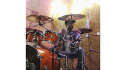 Young man playing a drumkit