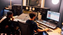 two producers work in a studio