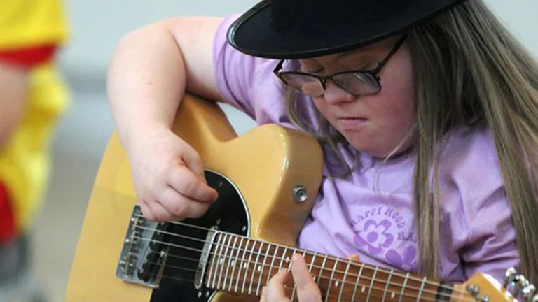 A girl playing the guitar