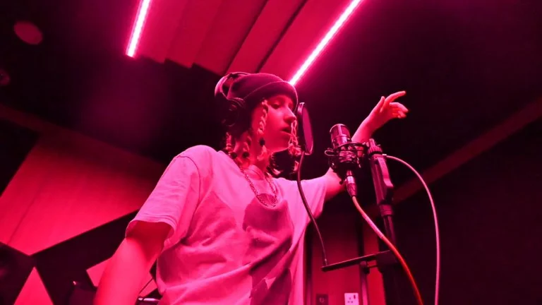 A woman singing in a studio