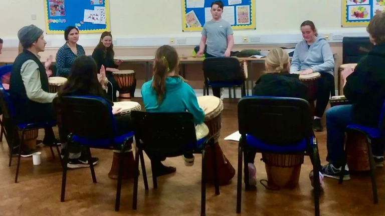 A group of children drumming