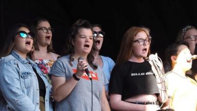 group of young people singing