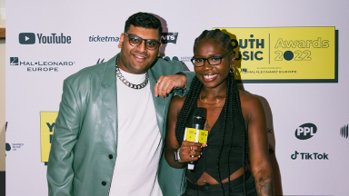 jade barnett and jameel sharriff pose together at the youth music awards