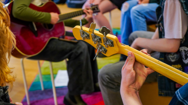 young people play guitars