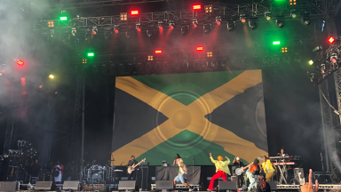 city splash festival with a jamaican flag on stage