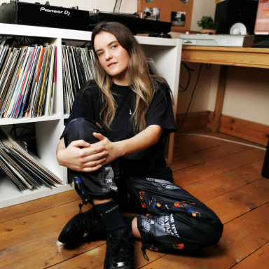 Abby Gray, Founder of A for Alpha sat with her record collection