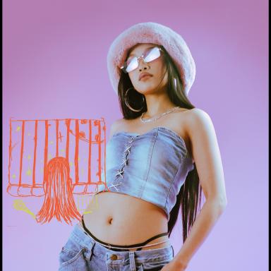 xyzelle wearing a denim two piece and fluffy hat and sunglasses