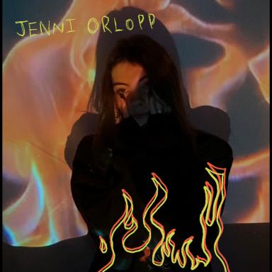Jenni Orlopp with her hands on either side of her face, standing against a background of fire