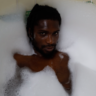 a man is submerged in a bubble bath