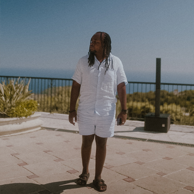 icey stanley has long hair and wears a white shirt and shorts
