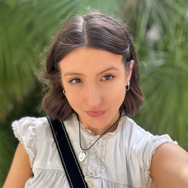 a woman with short brown hair takes a selfie